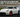 Nissan 370Z with wide angle drift kit initiating a high-speed corner at a drift event