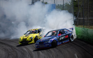 BMW E36 with full SLR drifting kit mid-corner on full lock