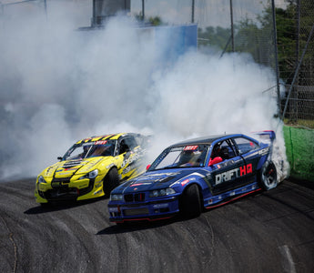 BMW E36 with full SLR drifting kit mid-corner on full lock