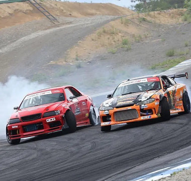 Lineup of best drift cars at a racetrack including BMW E36, Nissan 350Z, and S13