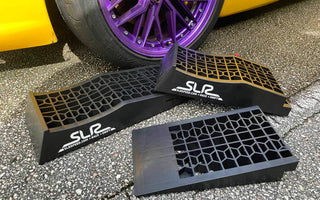 Low-profile race ramps under a lowered drift car