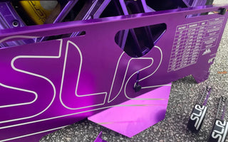 SLR toe plates in use at a drift event pit area, with tape measures and alignment checks in progress