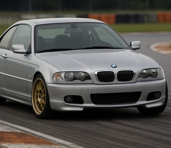BMW E46 cornering hard on a racetrack with upgraded coilovers installed
