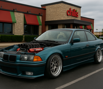 A slammed BMW E36 with NASCAR V8 engine exposed, parked in a Chili’s restaurant parking lot.