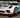 A Porsche 911 race car on SLR ramps for changing oil