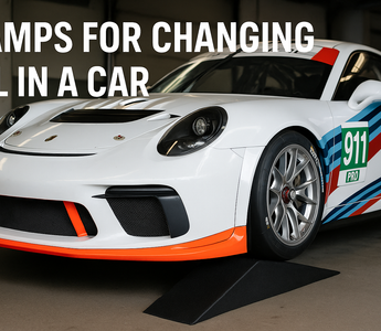 A Porsche 911 race car on SLR ramps for changing oil