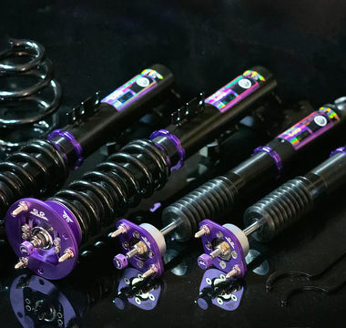 E36 coilover installed on front strut with adjustment knob visible