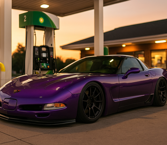 A slammed C5 corvette coilovers at lowest setting at a gas station
