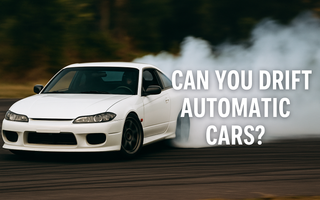 an automatic s15 nissan silvia drifting on a drift track