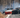 Three drift cars on a mountain pass drifting with different styles and techniques