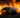 A professional car drifting through a fire lit track in Florida competition