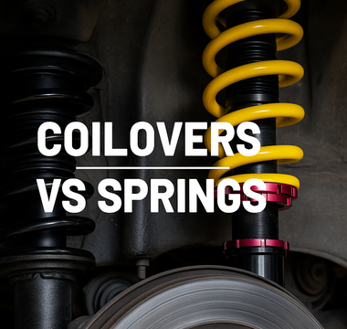 A picture of springs and coilovers side by side in wheel well of car