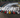 A line of 10 cars from a drone shot, on a florida race track drifting with crowds all around. Title over the image says DRIFT EVENTS