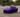 Chibi-style DriftKart D1 mid-slide in a parking lot, sized for adult rider with helmet and racing posture