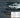 A drift car with wide front angle and smoke, displaying performance steering and suspension, on track. Overlayed with charts and bullet points of major tuning tips.