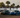 A 370Z and S14 drifting by a crowd at a drift event