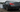 Drift car rear view with worn tires and suspension components visible after a drift session