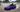 Driftkart style purple Nissan 180SX drift kart with single seat drifting at a skatepark, electric DriftKart training concept with gokart proportions and smoke trail