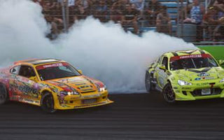 Drift car entering a high-speed corner at sunset at a Florida drift track.