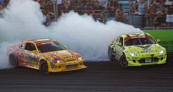 Drift car entering a high-speed corner at sunset at a Florida drift track.
