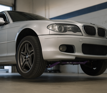 SLR 38 mm blade‑style front sway bar installed on a BMW E46 in a garage