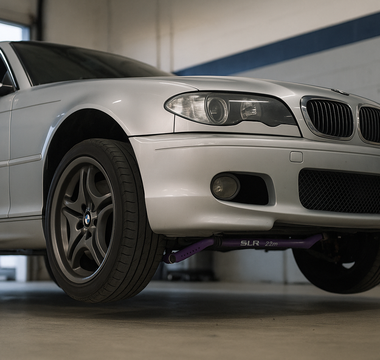 SLR 38 mm blade‑style front sway bar installed on a BMW E46 in a garage
