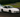 sports car mid-drift on a racetrack