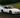sports car mid-drift on a racetrack