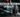 Close-up of a performance inner tie rod installed on a car steering rack with upgraded control arms