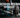 Close-up of a performance inner tie rod installed on a car steering rack with upgraded control arms