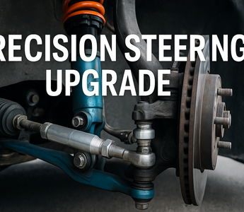 Close-up of a performance inner tie rod installed on a car steering rack with upgraded control arms