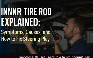 A mechanic looking at a car on the lift and its inner tire rod