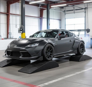 garage setup with car on low ramps