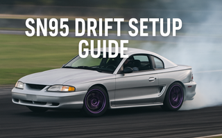 SN95 Mustang mid-drift with visible camber and rear squat, coilovers in action