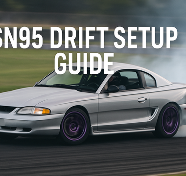 SN95 Mustang mid-drift with visible camber and rear squat, coilovers in action