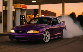 SN95 Mustang drift car drifting around a gas pump in Florida