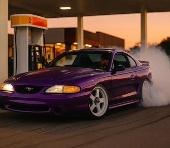 SN95 Mustang drift car drifting around a gas pump in Florida