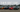 Tokyo Drift movie cars lineup including Veilside RX-7, Nissan 350Z, and Mitsubishi Evo