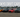 Tokyo Drift movie cars lineup including Veilside RX-7, Nissan 350Z, and Mitsubishi Evo