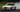 BMW E36 drift car at angle showing lowered coilover suspension and drift-tuned steering geometry