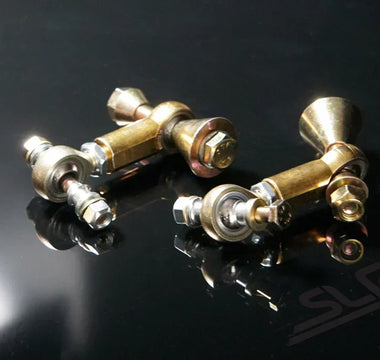 Close-up of sway bar links mounted on a car suspension system